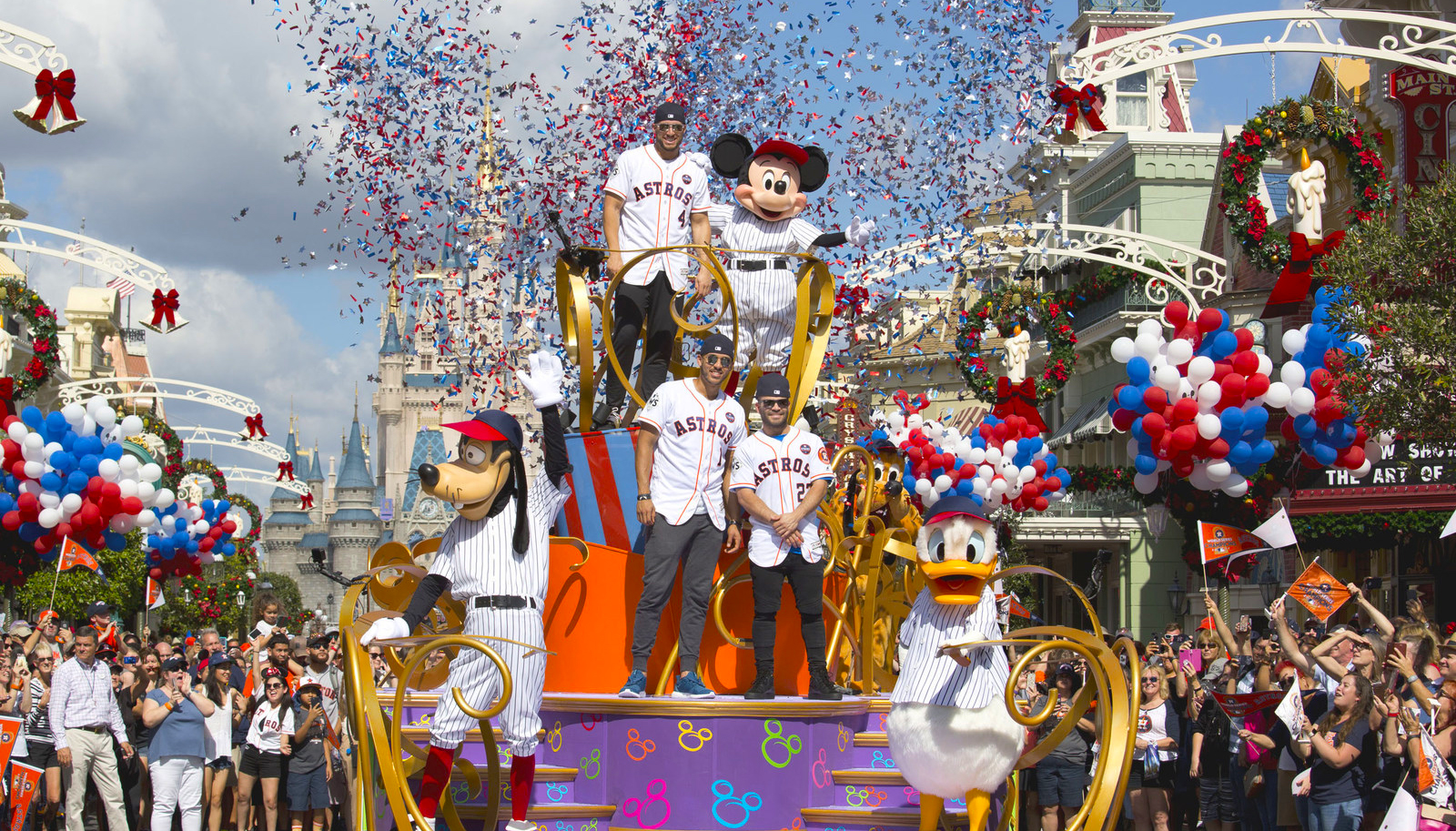 Houston Astros star players (top, then bottom l-r) World Series MVP George Springer, All-Star Carlos Correa and American League batting champion Jose Altuve lead off a World Series victory parade Saturday, Nov. 4, 2017, at Magic Kingdom Park in Lake Buena Vista, Fla. The Walt Disney World Parade saluted the team's first world title in its 56-year history. (Gregg Newton, photographer)